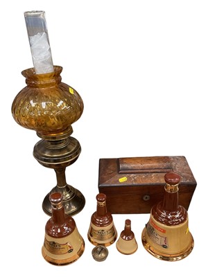 Lot 24 - Tea caddy, bells whisky bottles, lamp