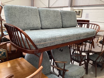 Lot 5344 - Ercol dark elm sofa together with a matching rocking chair, armchair and foot stool