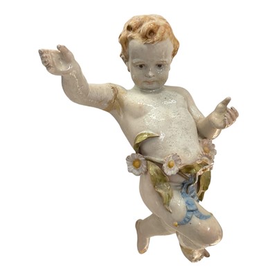 Lot 135 - Antique Continental tin glazed putto figure