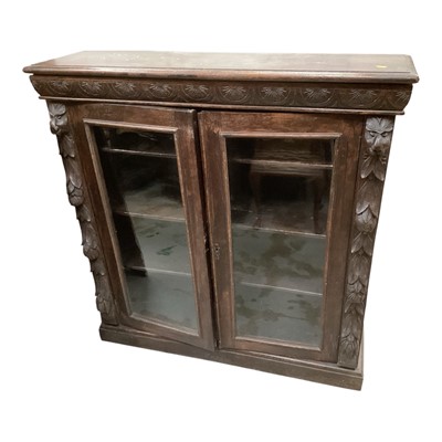 Lot 1312 - Late 19th century carved oak bookcase