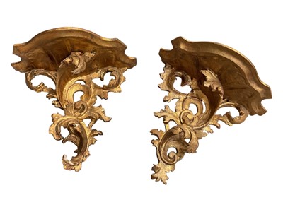 Lot 13 - Pair of gilt wood wall brackets with scrolling foliate decoration, 26.5cm wide x 23cm high
