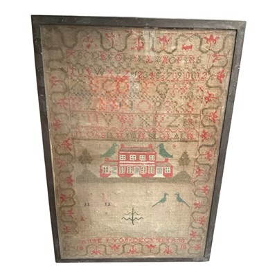 Lot 31 - Early 19th century needlework sampler depicting a central house, birds and alphabet, by Anne Lyon 1810, in glazed frame