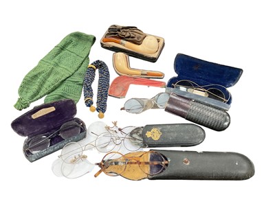 Lot 337 - Group of antique spectacles, two pipes and two misers purses