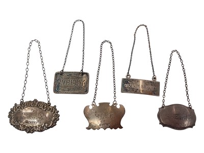 Lot 927 - Five silver spirit labels