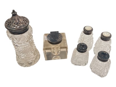 Lot 928 - Silver mounted glass inkwell, silver mounted cut glass sugar caster, and two pairs of silver mounted glass salt and pepper shakers