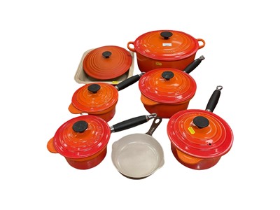 Lot 400 - Le Creuset pots with covers, a pan and baking dish