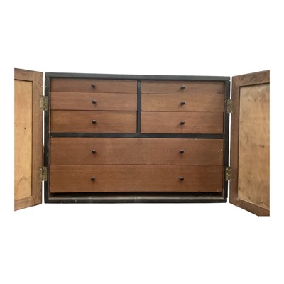 Lot 1335 - Black painted collectors cabinet with an arrangement of drawers enclosed by two panelled doors, 51cm wide, 23.5cm deep