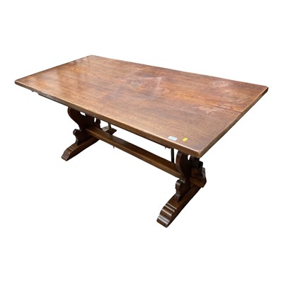 Lot 1346 - Oak refectory table on shaped pierced end standards joined by stretcher, 167cm x 82cm x 76cm high