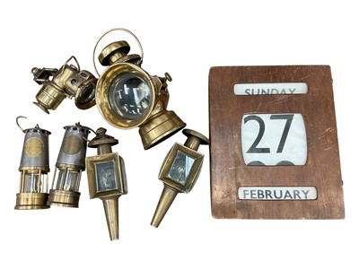 Lot 96 - Sundry items, including brass miner's lamp, other brassware, a perpetual wall calendar, boxed set of James Bond VHS tapes, and porcelain door plates