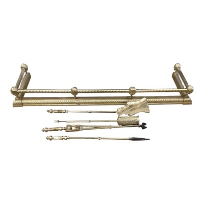 Lot 1353 - Victorian style brass fender, 130cm wide, together with a selection of brass fire irons