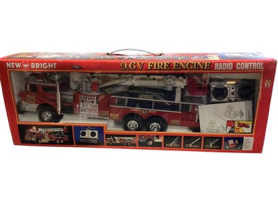 Lot 520 - New Bright radio controlled 9.6V fire engine, Corgi Scammell Highwayman R Edward's Amusements truck 97920 and Days Gone diecast vehicles (qty)