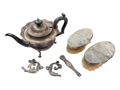 Lot 911 - Silver teapot, pair of silver backed brushes, pair of white metal angel handles and one other handle