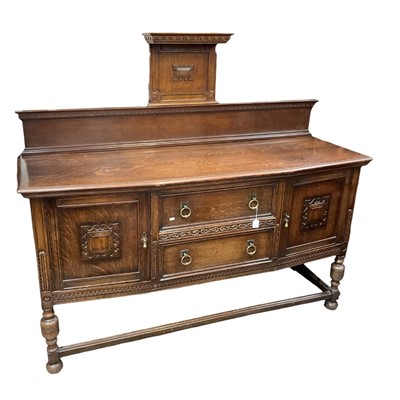 Lot 1363 - 1920's carved oak sideboard with raised ledge back, two central drawers below flanked by cupboards, 182cm wide, 62cm deep, 160cm high