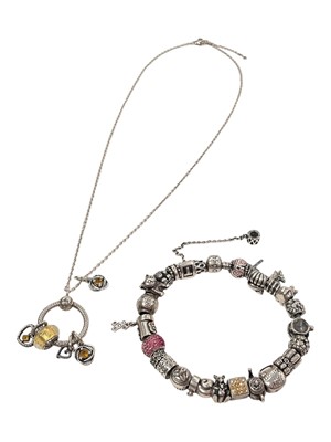 Lot 987 - Pandora silver charm bracelet with a full band of novelty charms, 23cm long, and a Pandora silver charm necklace (2)
