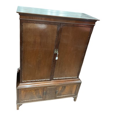 Lot 1377 - Edwardian mahogany two height cupboard with shelved interior enclosed by two panelled doors, with two further doors below