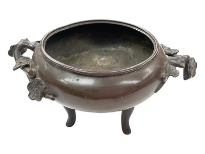 Lot 351 - Chinese bronze censor raised on three feet with two floral handles