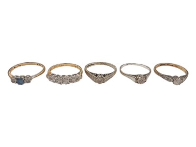 Lot 951 - Five 9ct gold gem set rings to include a sapphire and diamond three stone ring, diamond five stone ring in illusion setting, two other diamond rings and a synthetic single stone ring
