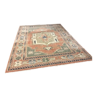 Lot 1417 - Large rug with central medallion on peach, green, blue and cream ground, 332cm x 247cm