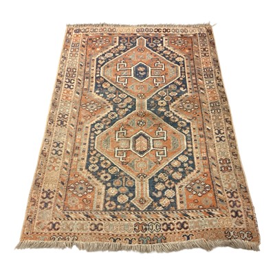 Lot 1422 - Eastern rug/wall hanging with two central medallions on blue and red ground, 129cm x 89cm
