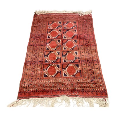 Lot 1428 - Two Eastern rugs with central medallions on red and blue ground, 142cm x 92cm and 100cm x 73cm