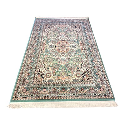 Lot 1434 - Eastern rug with central medallion on green, cream and red ground, 205cm x 125cm