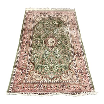 Lot 1436 - Eastern rug with central medallion on pink and green ground, 160cm x 93.5cm
