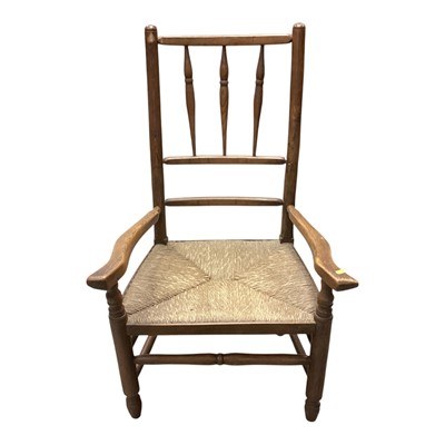 Lot 1455 - Antique oak elbow chair with spindle back