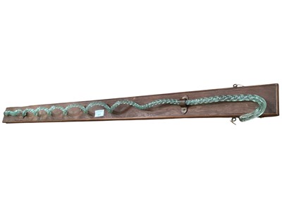 Lot 547 - Victorian novelty twisted glass walking stick, on wooden plinth (1)