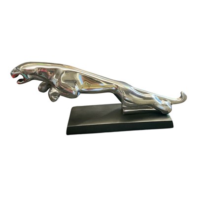 Lot 11 - Polished metal Jaguar Cars desk ornament / mascot mounted on rectangular base, 30.5cm in length.