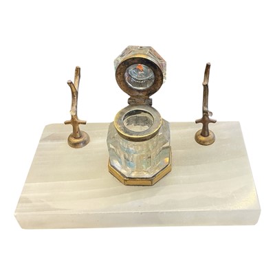 Lot 395 - Victorian onyx desk stand with central cut glass inkwell and gilt metal pen rests modelled as branches, raised on four ball feet, 17.3cm in length.