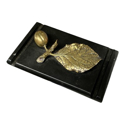 Lot 397 - Victorian black slate and brass desk weight / pen rest, mounted with a model of a leaf and fruit, 15.5cm in length.