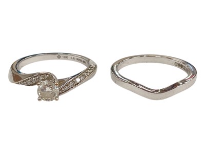 Lot 1028 - Diamond single stone ring with a certificated round brilliant cut diamond weighing 0.34cts in cross-over setting with diamond set shoulders in 18ct white gold, total diamond weight approximately...