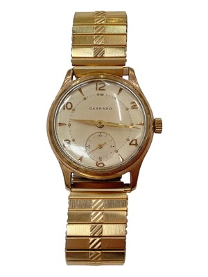 Lot 1000 - 1960s 9ct gold cased Garrard wristwatch with presentation inscription to the reverse, on gold plated expandable bracelet