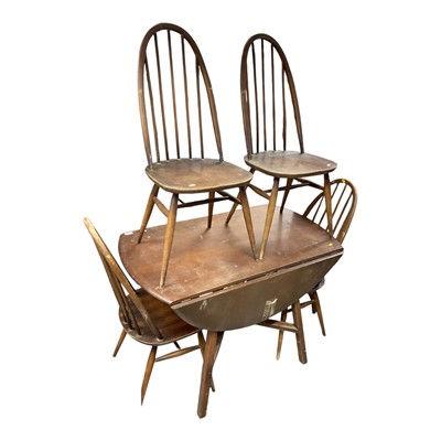 Lot 1480 - Ercol drop leaf dining table together with four stick back chairs
