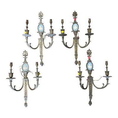 Lot 214 - Group of four neoclassical style brass wall lights with jasperware portrait relief plaques, 49cm high