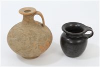 Lot 112 - Roman red terracotta bulbous bottle with loop...