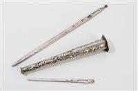Lot 712 - George II silver bodkin with engraved ornament...