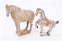 Lot 144 - Two Chinese pottery tomb-type figures of...