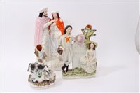 Lot 137 - Victorian Staffordshire figure group of a dog...