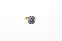 Lot 600 - Sapphire and diamond cluster ring with oval...