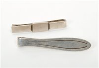Lot 345 - Two Danish silver tie clips by Georg Jensen,...