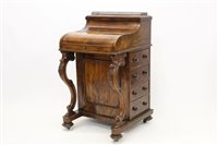 Lot 1302 - Mid-Victorian walnut piano-top davenport, the...