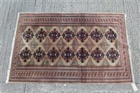 Lot 1394 - Tekke style part silk rug with two rows of...