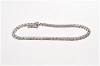 Lot 541 - Diamond tennis bracelet with a line of 55...