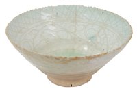 Lot 100 - 12th century Iranian white and green tinted...