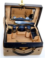 Lot 382 - 1920s leather travelling vanity case with...