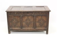 Lot 1239 - 17th century carved oak coffer with panelled...