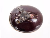 Lot 578 - Victorian cabochon garnet surmounted with a...