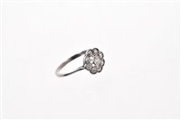 Lot 597 - Edwardian diamond cluster ring with an...