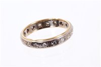 Lot 553 - Diamond eternity ring with a full band of...